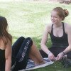 two girls sitting on lawn at SRA
