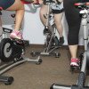 girls on stationary exercise bikes