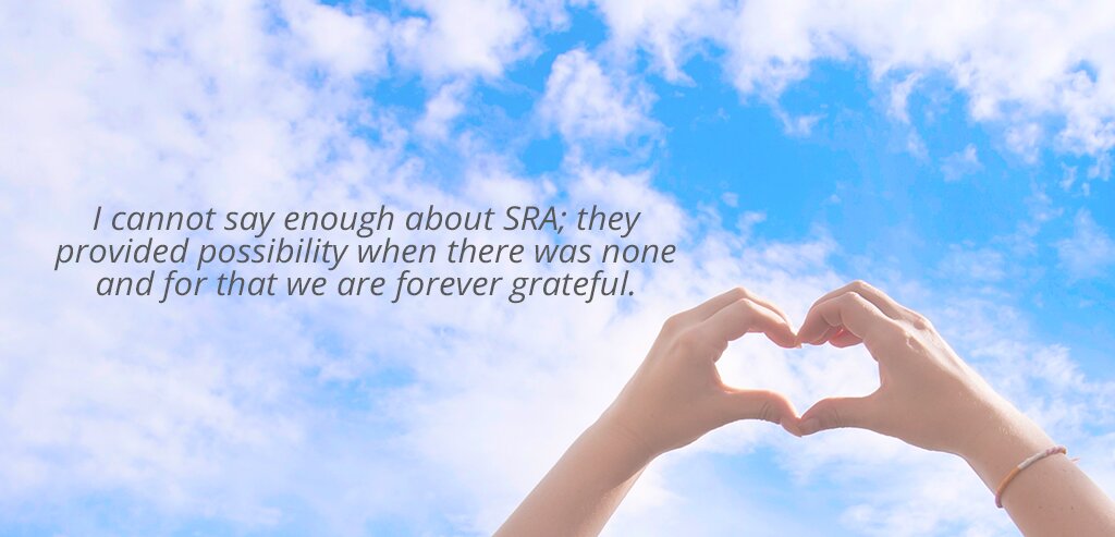 Blue Sky with clouds and hands shaped as a heart